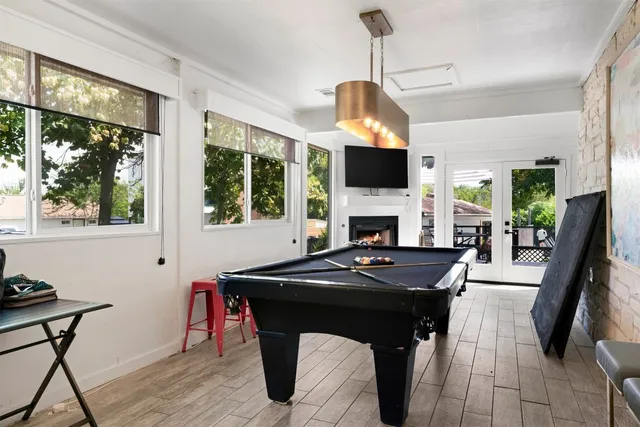 a view of a livingroom with furniture window and wooden floor