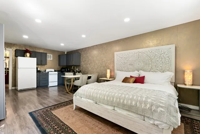 a bedroom with a bed and a couch