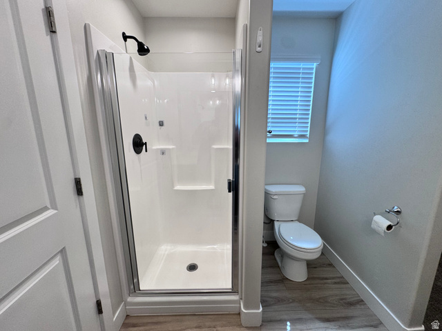 12339 Remy Road, Unit 422 Herriman, UT 84096 - Photo 23 of 36 Full bath featuring a shower stall and light wood-type flooring