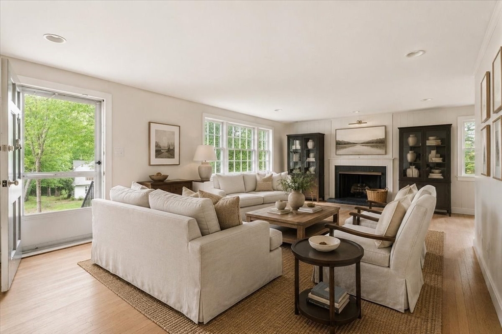99 Brook Road Sharon, MA 02067 - Photo 6 of 37 a living room with furniture and a fireplace
