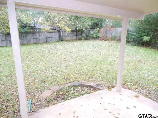 a view of a back yard from a room