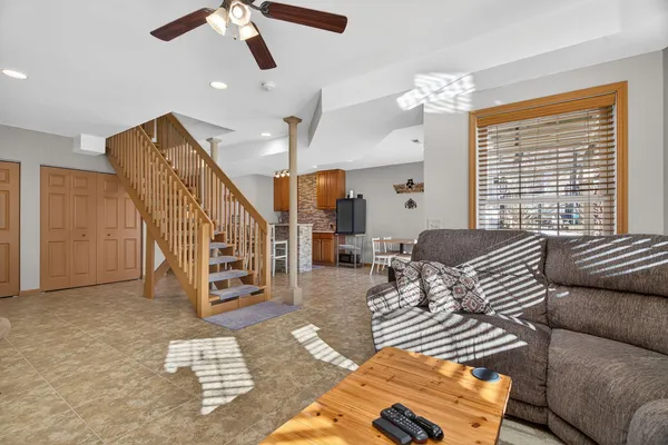 a kitchen with stainless steel appliances granite countertop a stove a sink cabinets and a refrigerator