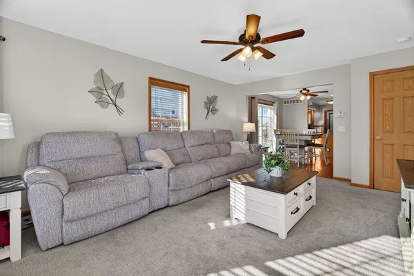 a kitchen with stainless steel appliances granite countertop wooden cabinets stove top oven and sink