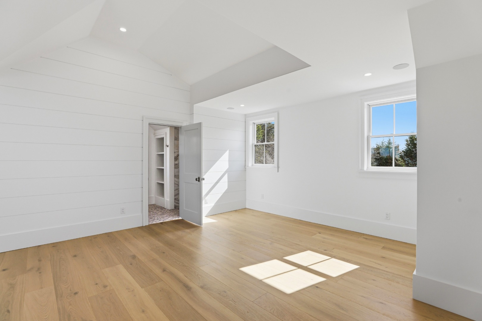 10 Rudder Lane Nantucket, MA 02554 - Photo 19 of 33 an empty room with wooden floor and windows