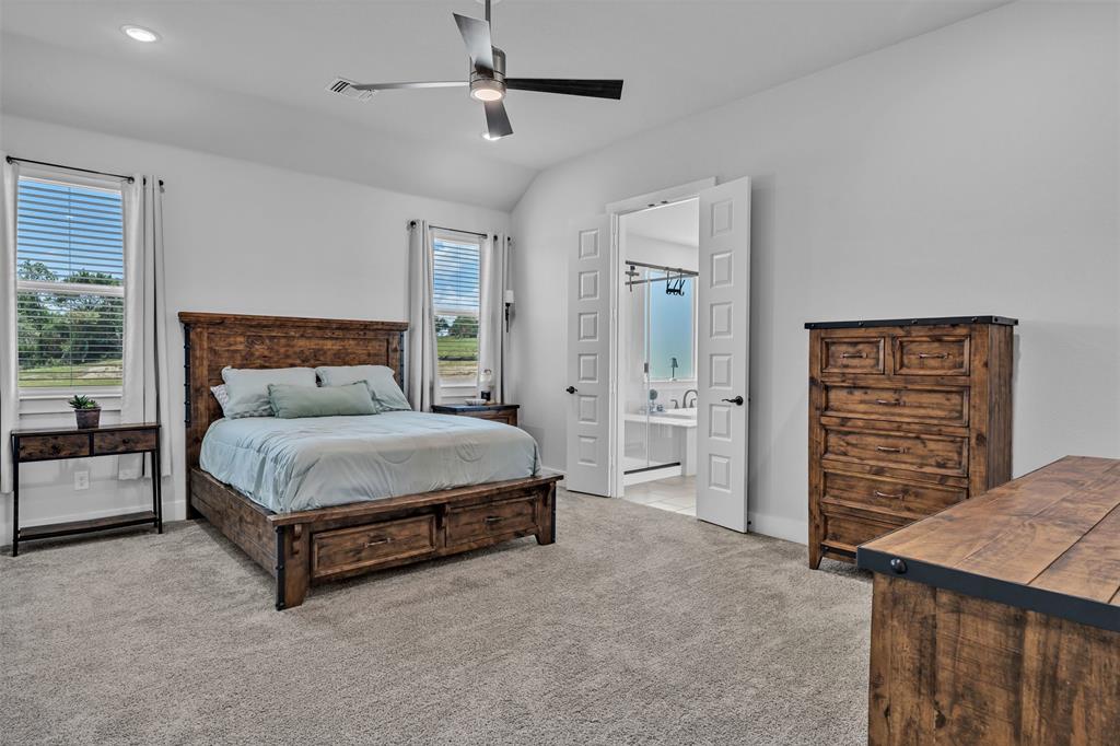 2004 Willy Dilly Road Springtown, TX 76082 - Photo 24 of 40 Carpeted bedroom with a vaulted ceiling, recessed lighting, and a contemporary ceiling fan