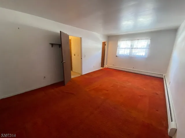 a bathroom with a sink toilet mirror and vanity