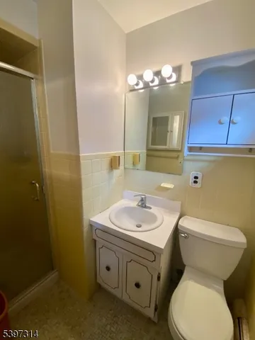 a view of yard covered with snow and trees