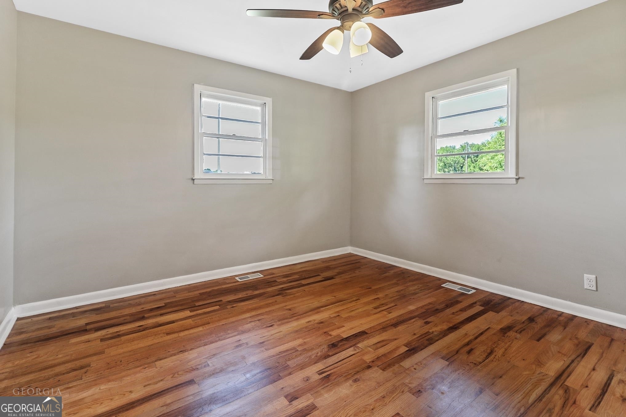 55 Welcome Sargent Road Newnan, GA 30263 - Photo 13 of 20 a view of an empty room with wooden floor and a window