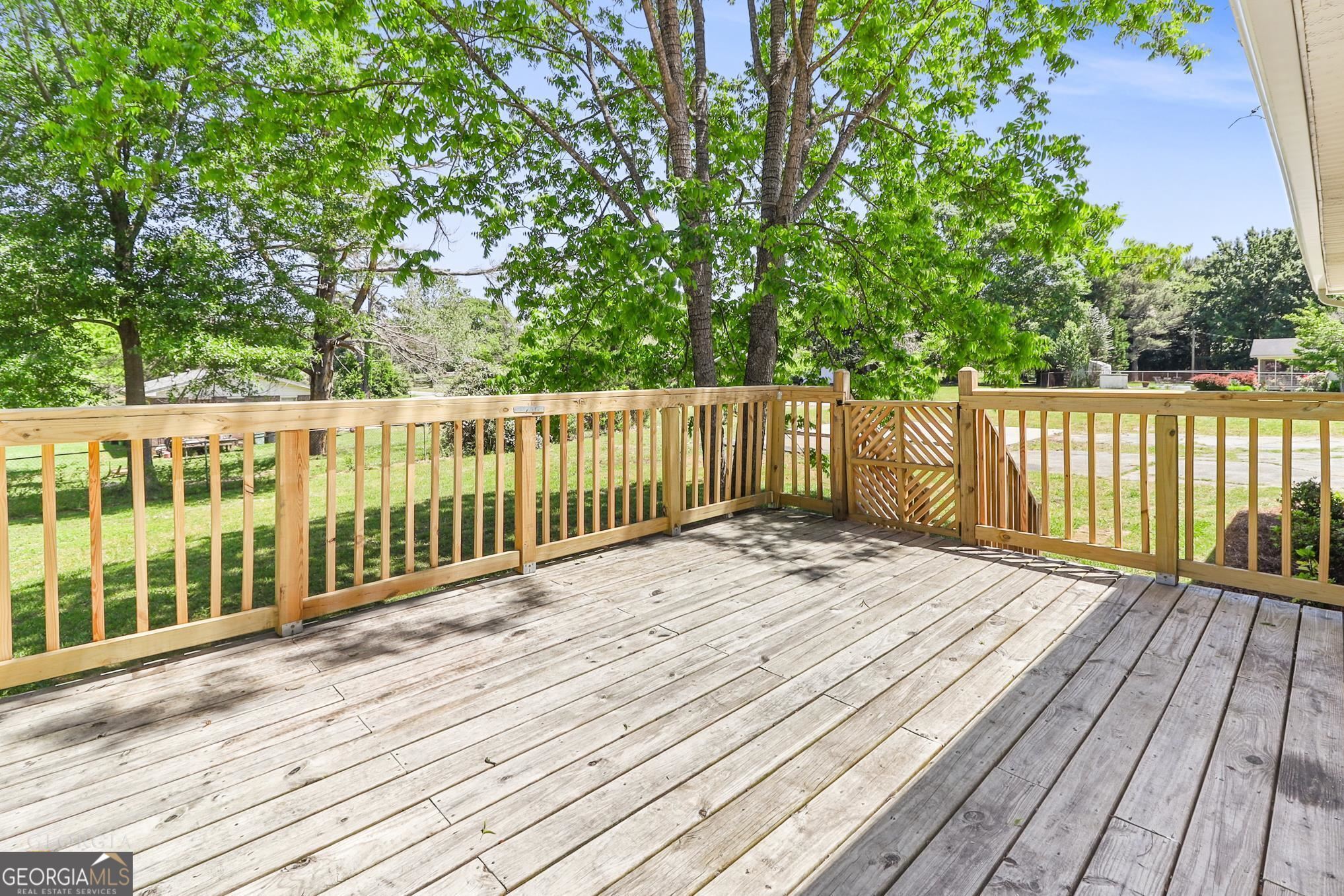 55 Welcome Sargent Road Newnan, GA 30263 - Photo 16 of 20 a view of wooden deck and a garden