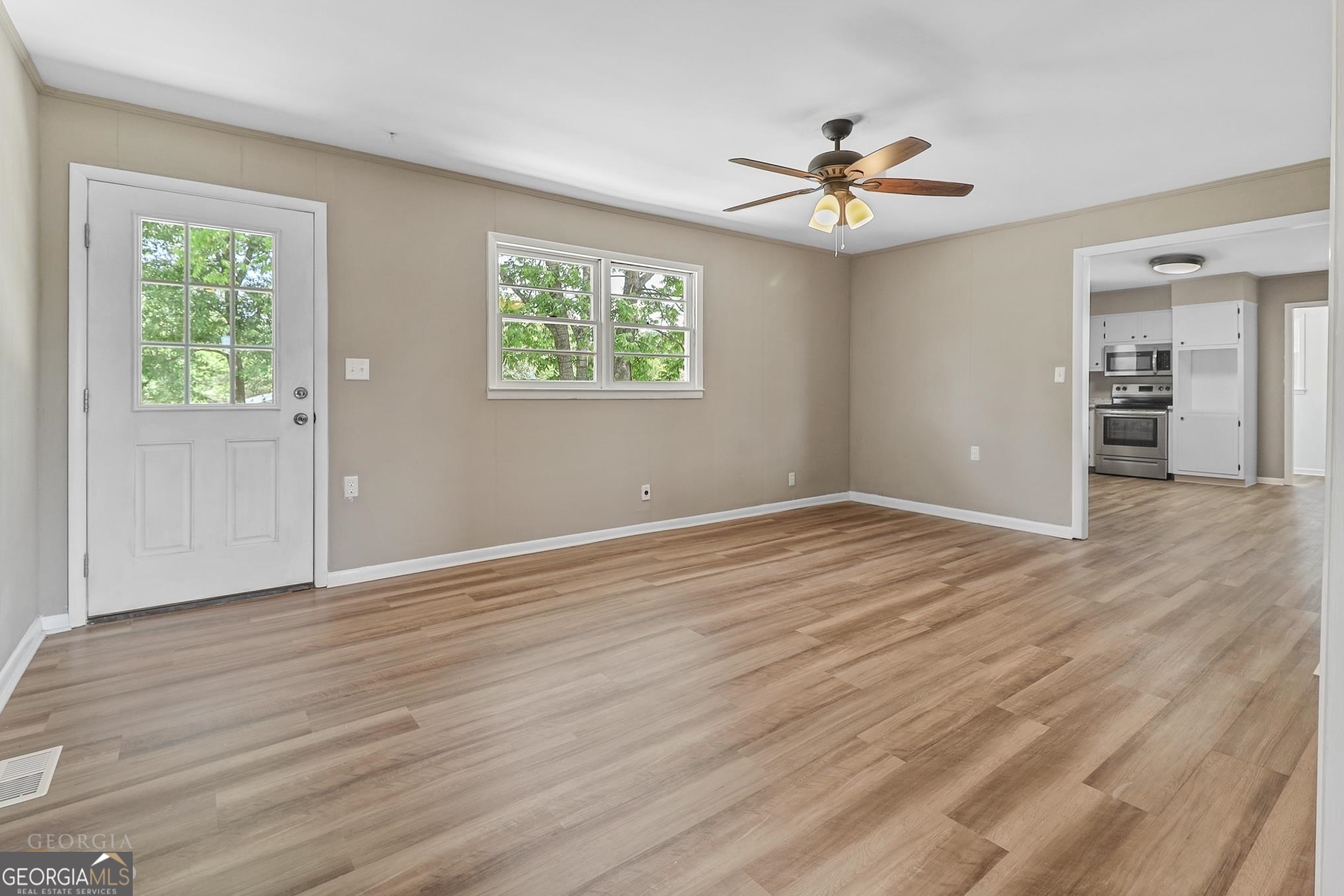55 Welcome Sargent Road Newnan, GA 30263 - Photo 6 of 20 wooden floor in an empty room with a window