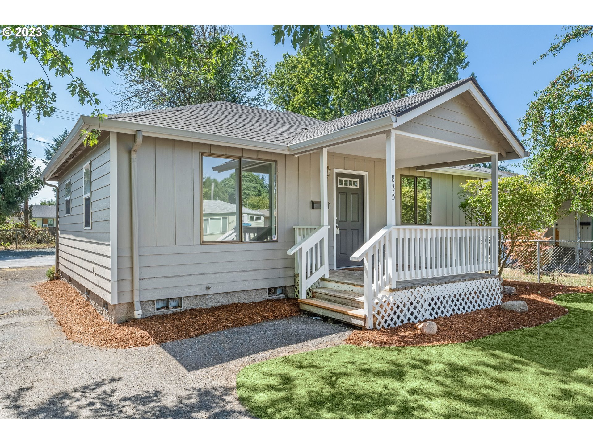 835 L Street Springfield, OR 97477 - Photo 2 of 40 a view of a house with a small yard and wooden floor