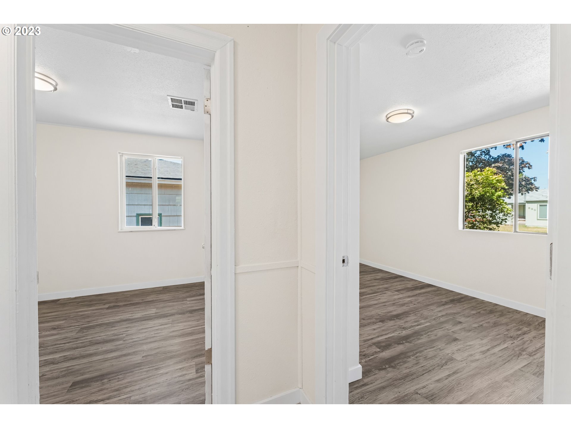835 L Street Springfield, OR 97477 - Photo 24 of 40 a view of an empty room with wooden floor and a window