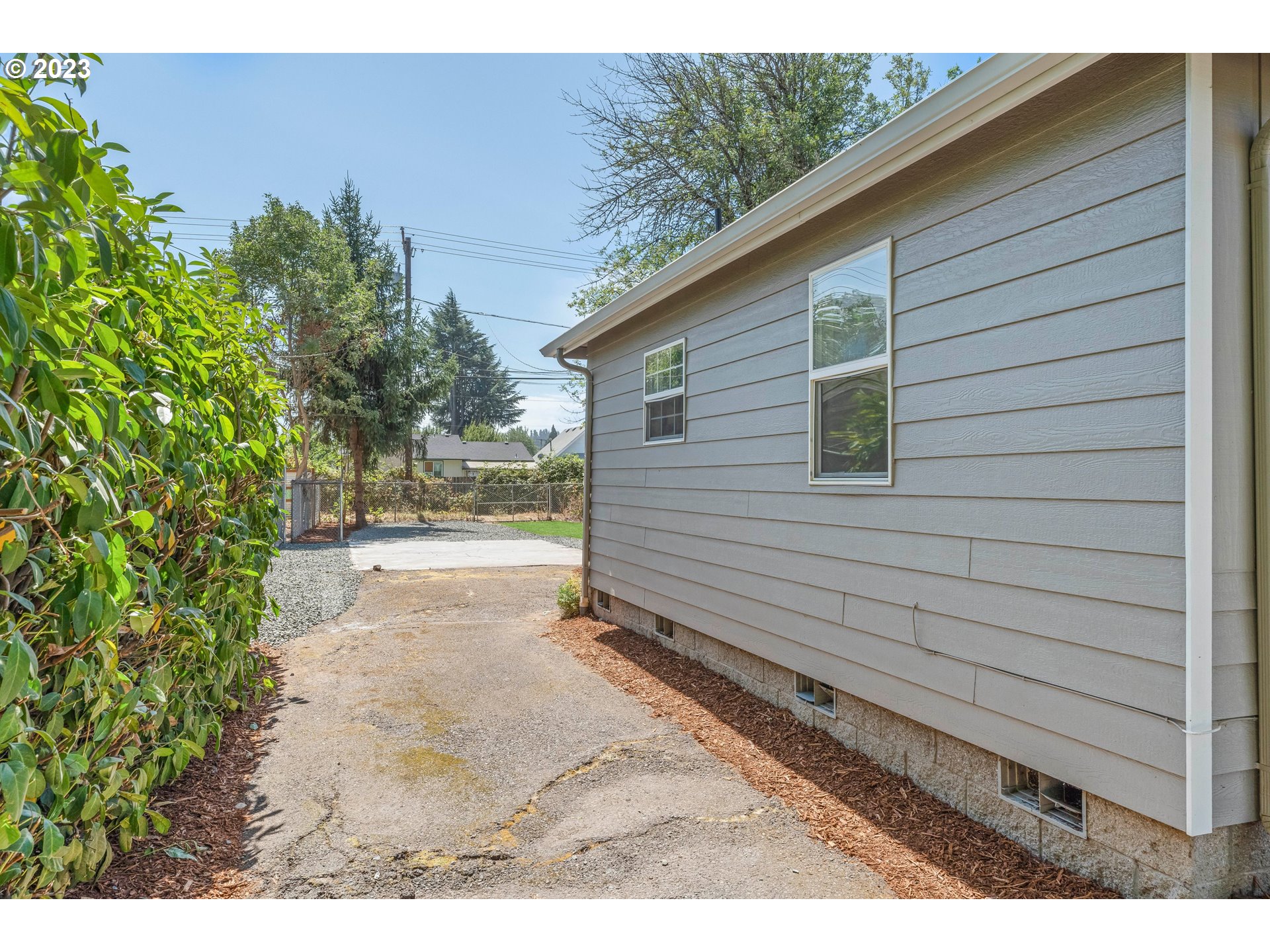 835 L Street Springfield, OR 97477 - Photo 33 of 40 a view of a backyard with pathway