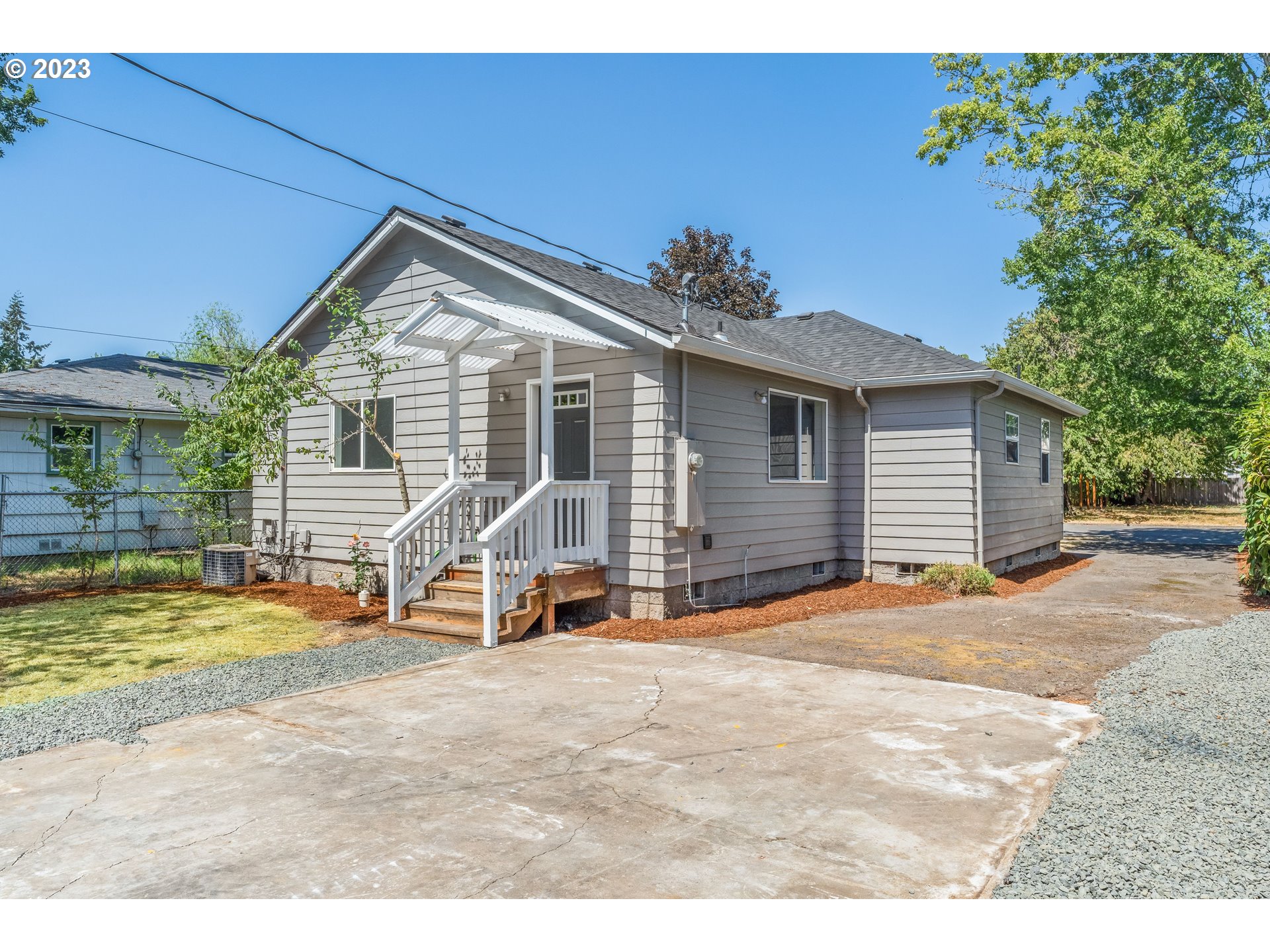 835 L Street Springfield, OR 97477 - Photo 34 of 40 a view of a house with backyard porch and sitting area