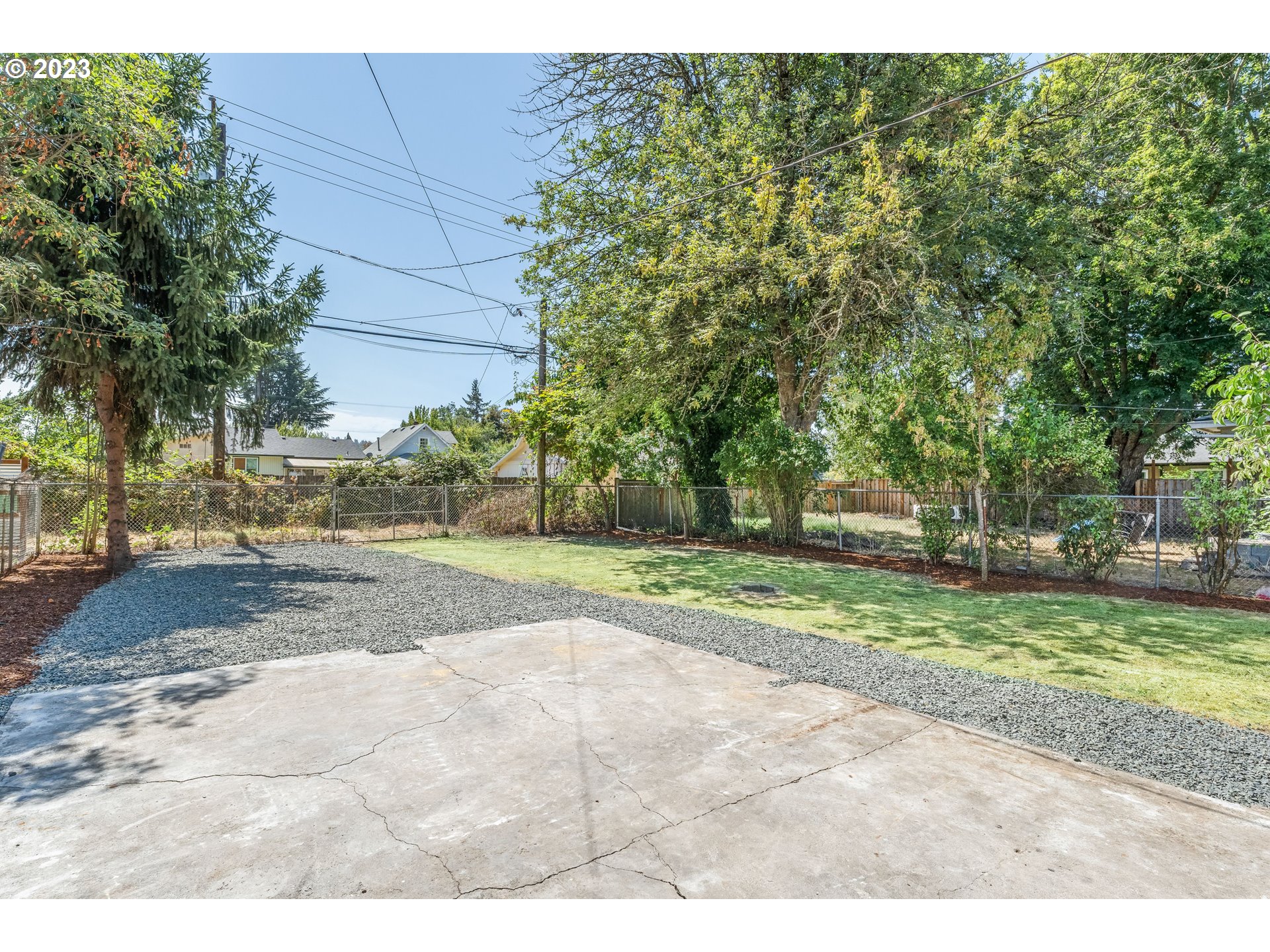 835 L Street Springfield, OR 97477 - Photo 39 of 40 a view of a yard with plants and trees