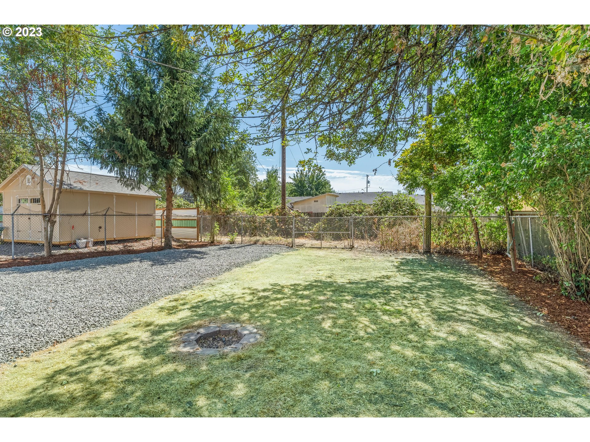 835 L Street Springfield, OR 97477 - Photo 40 of 40 a view of a backyard with large trees