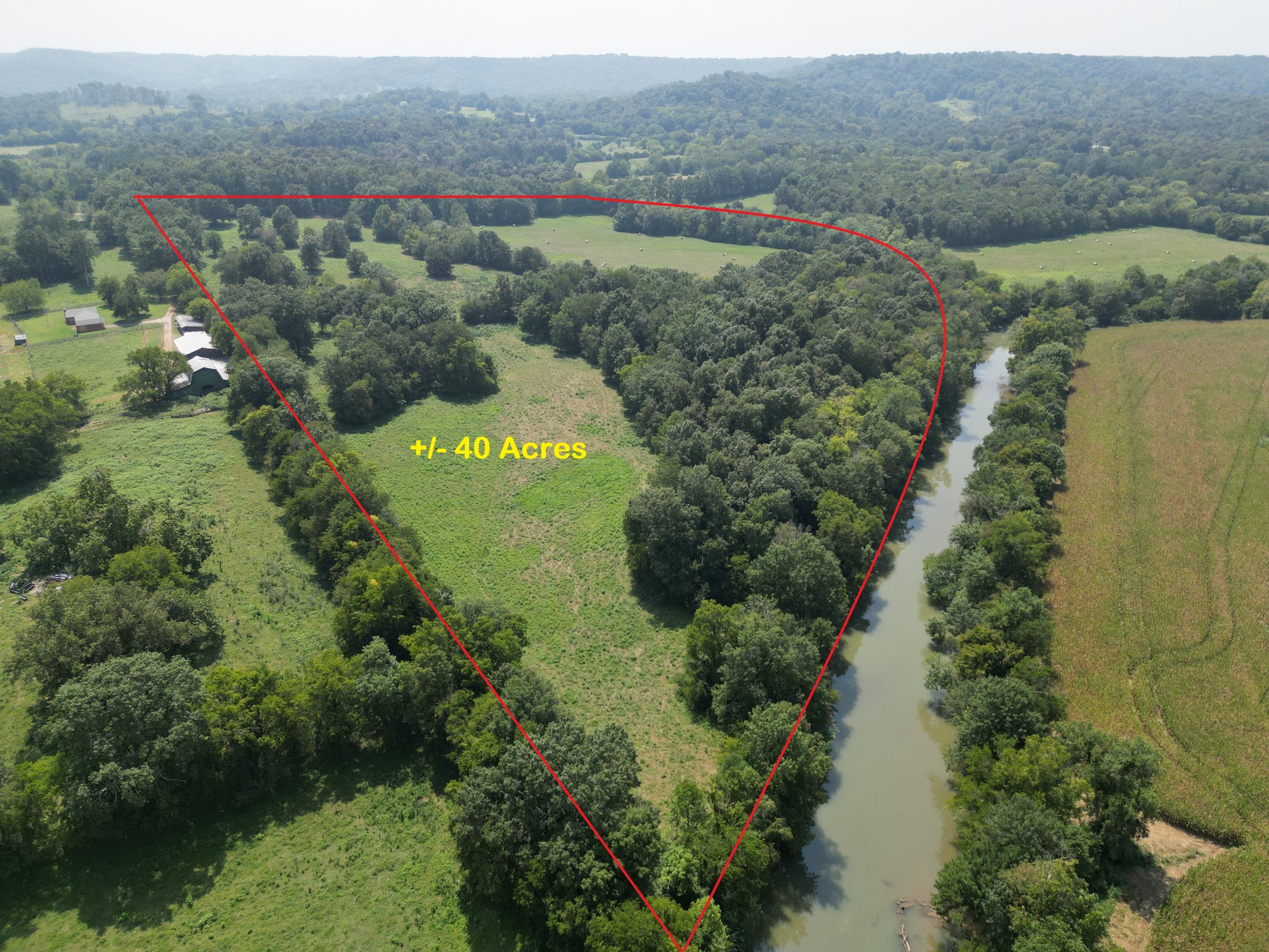 0 Joe Gulley Road Pulaski, TN 38478 - Photo 1 of 42 an aerial view of green landscape with trees houses and mountain view