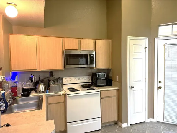 a kitchen with a microwave a stove and a microwave