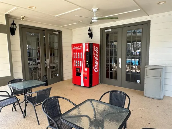 a dinning room with furniture and window