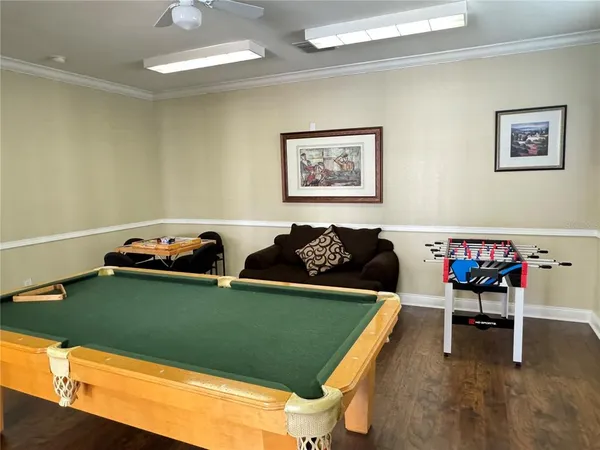 a view of a room with chairs and table
