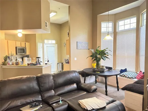 a living room with furniture and a large window