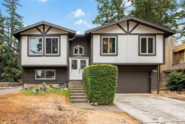 a front view of a house with garden