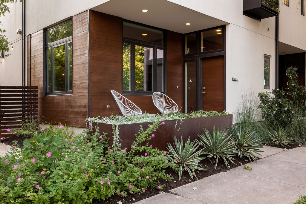 a front view of a house with garden
