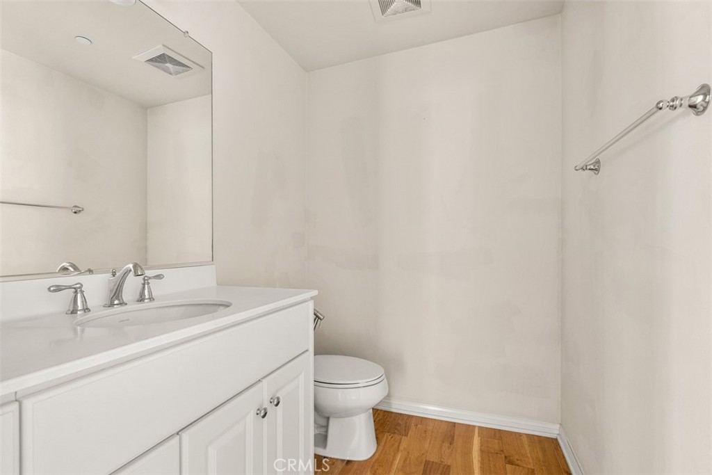 32 Serenity Irvine, CA 92618 - Photo 13 of 34 a bathroom with a sink a toilet and a mirror