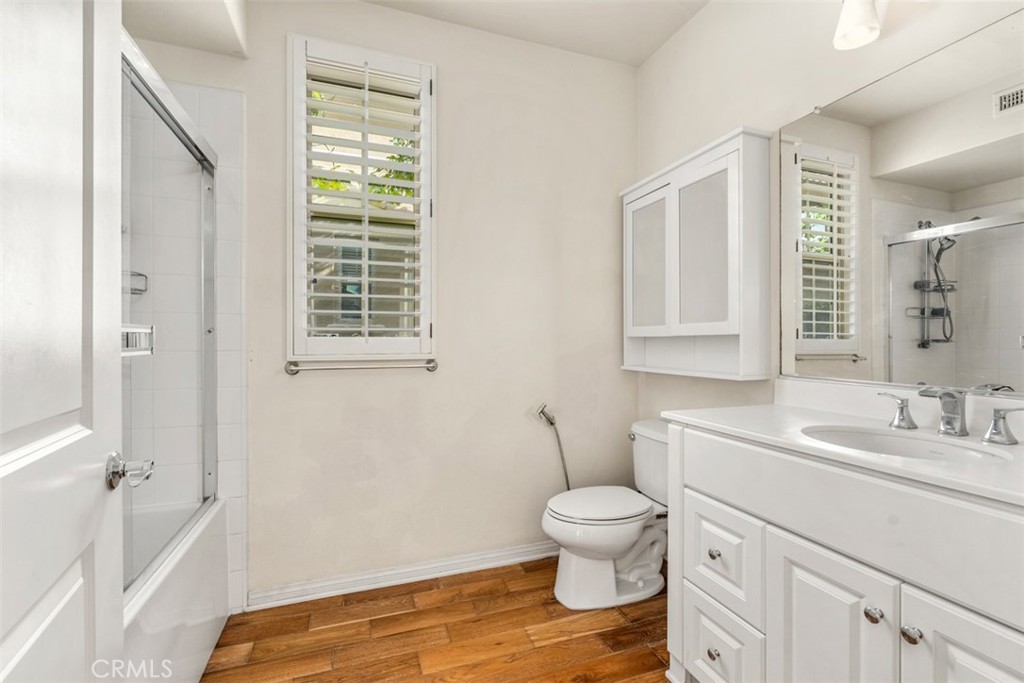 32 Serenity Irvine, CA 92618 - Photo 16 of 34 a bathroom with a toilet sink and a mirror