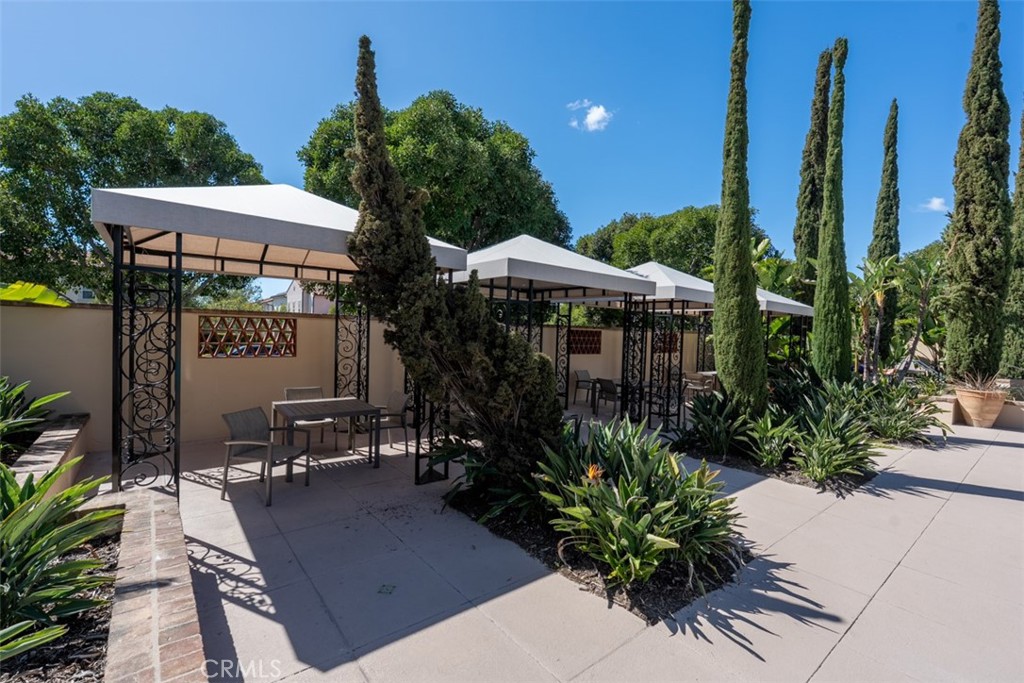 32 Serenity Irvine, CA 92618 - Photo 30 of 34 a view of a patio with table and chairs potted plants