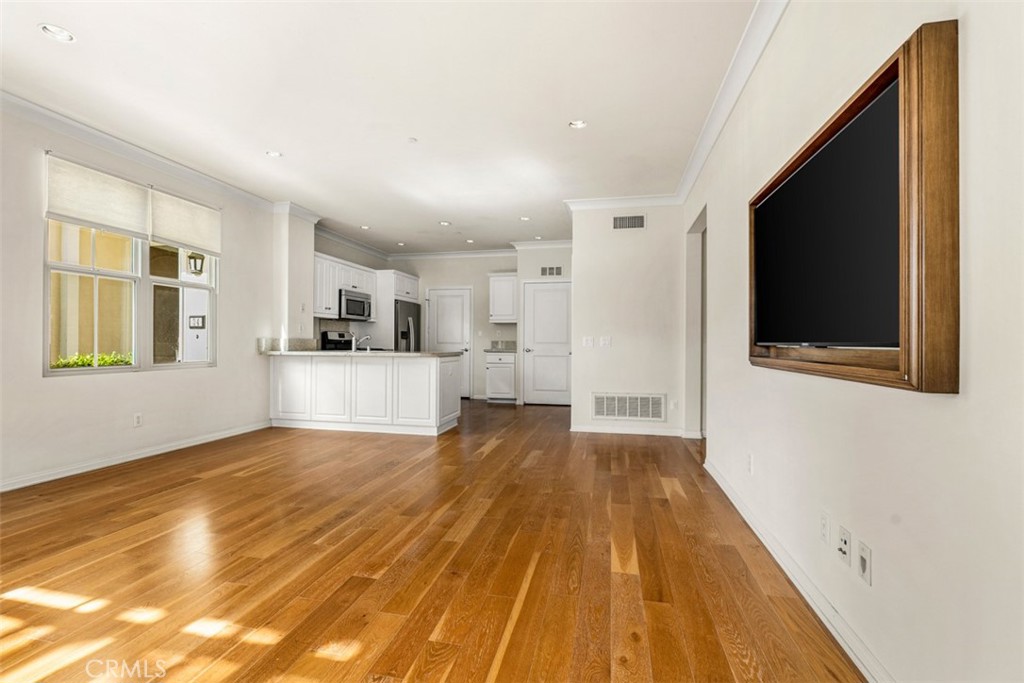 32 Serenity Irvine, CA 92618 - Photo 4 of 34 a view of empty room with wooden floor and fan
