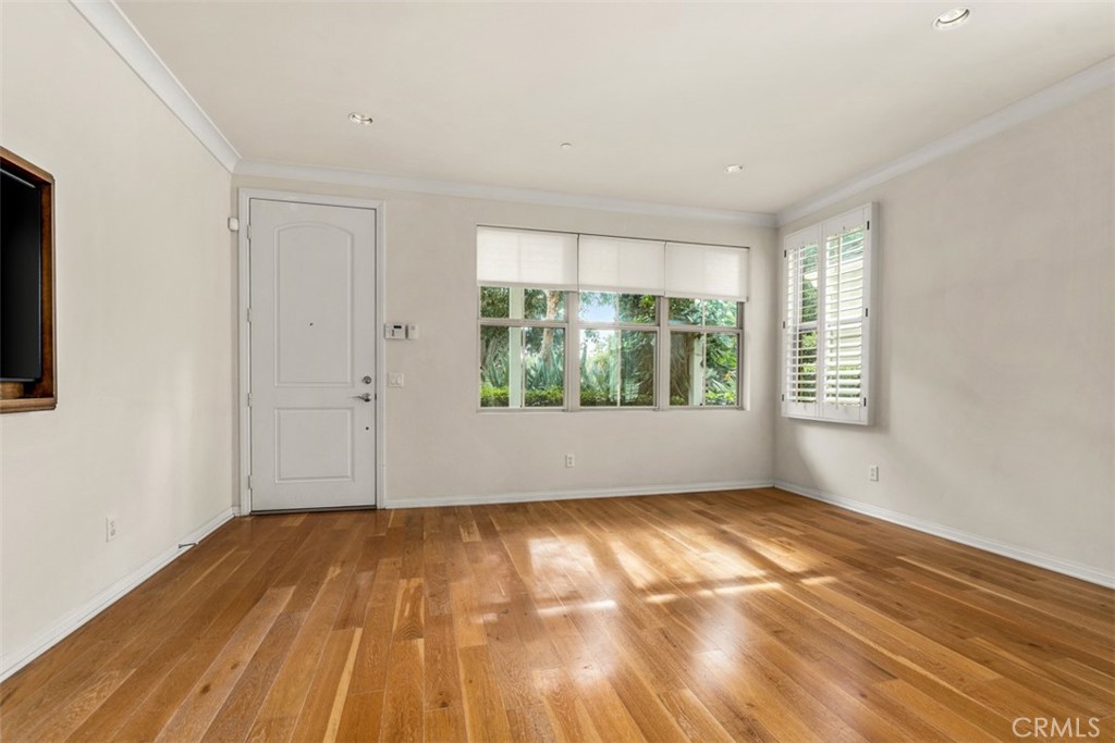 32 Serenity Irvine, CA 92618 - Photo 5 of 34 a view of an empty room with wooden floor and a window