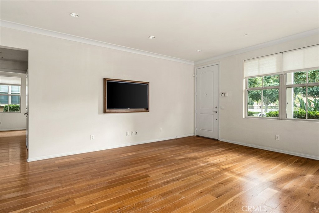 32 Serenity Irvine, CA 92618 - Photo 9 of 34 a view of an empty room with wooden floor and a window