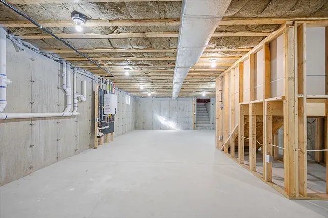 a view of an empty room with wooden walls
