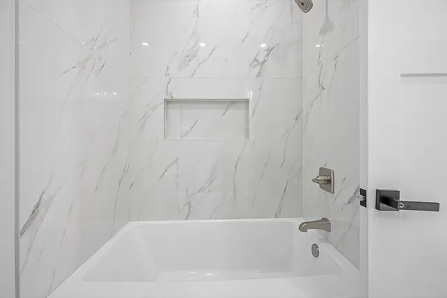 a bathroom with a bathtub