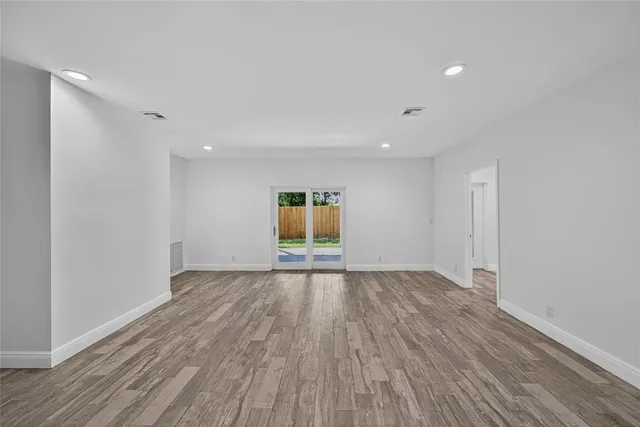 a view of an empty room with a windows