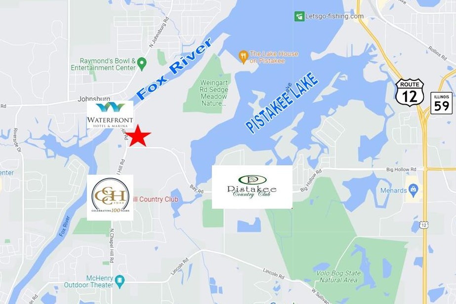 3114 North Chapel Hill Road Johnsburg, IL 60051 - Photo 3 of 3 a room with a refrigerator and a table