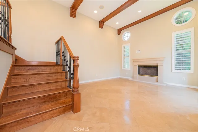 a view of entryway with wooden floor and a fireplace