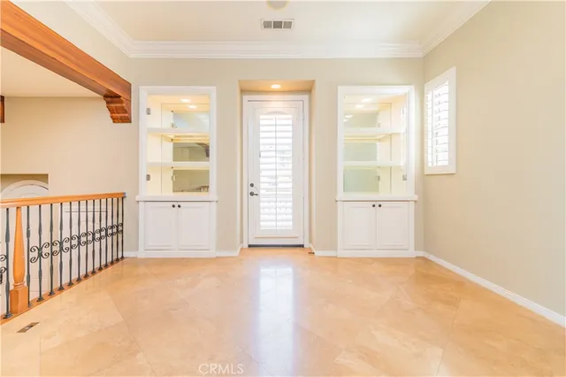 a kitchen with kitchen island granite countertop a sink counter top space cabinets and stainless steel appliances