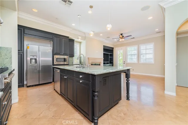 a bathroom with a sink a vanity and a large mirror
