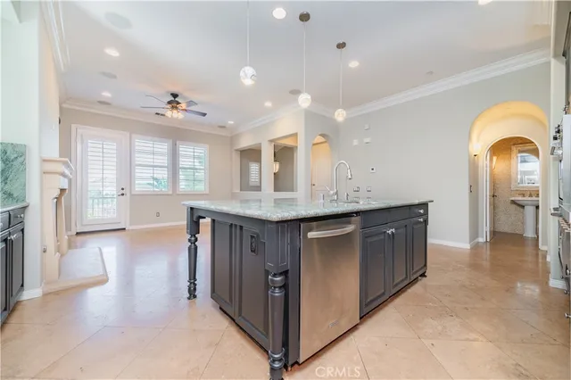 a kitchen with stainless steel appliances a sink and a stove top oven