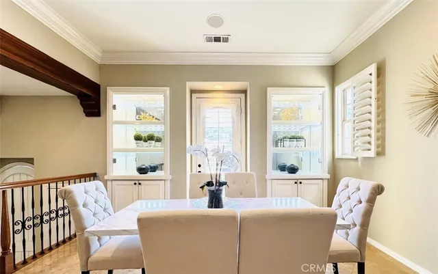 a living room with furniture and large windows