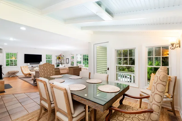 a living room with furniture and flat screen tv