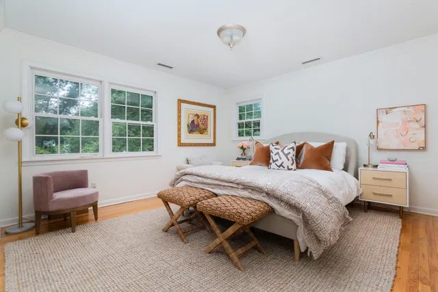 a bedroom with furniture and a window