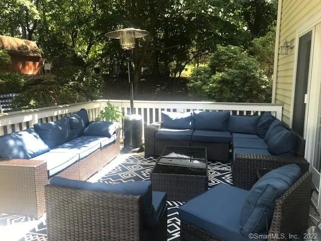 a outdoor living space with furniture and a fireplace