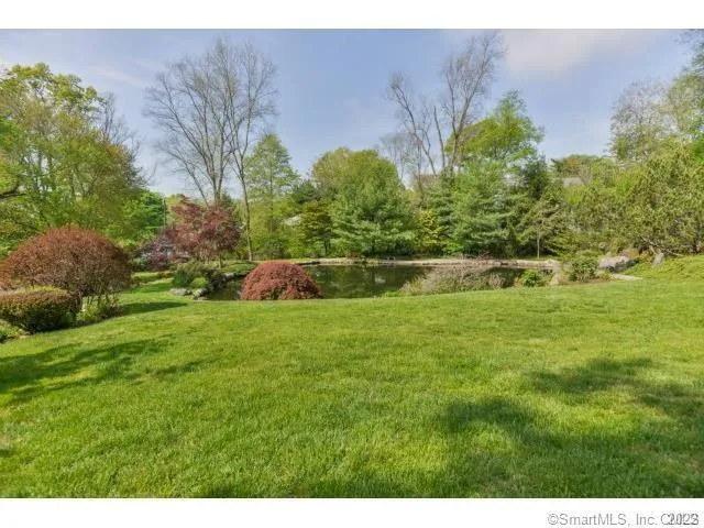 a backyard of a house with lots of green space