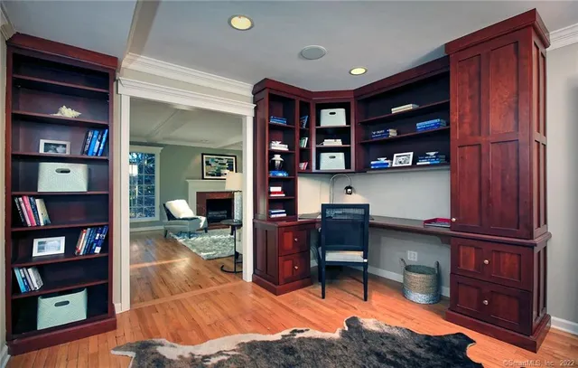 a view of a workspace with bookshelf