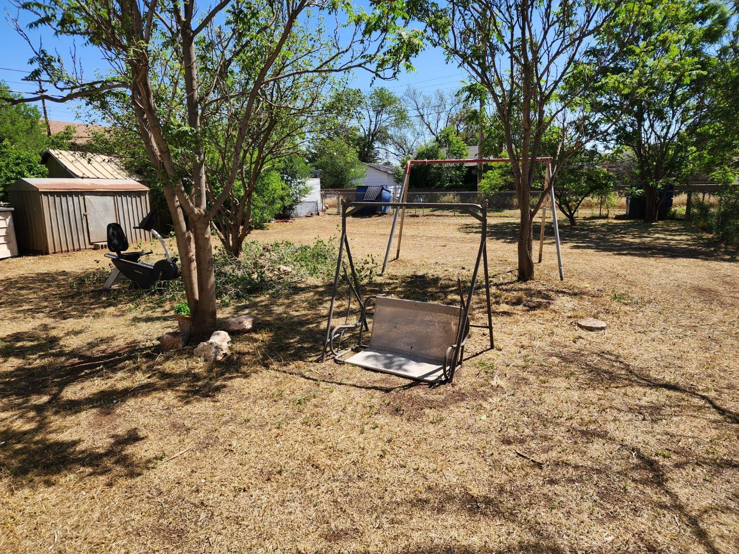 230 South 11th Street Slaton, TX 79364 - Photo 10 of 10 a view of a house with a yard