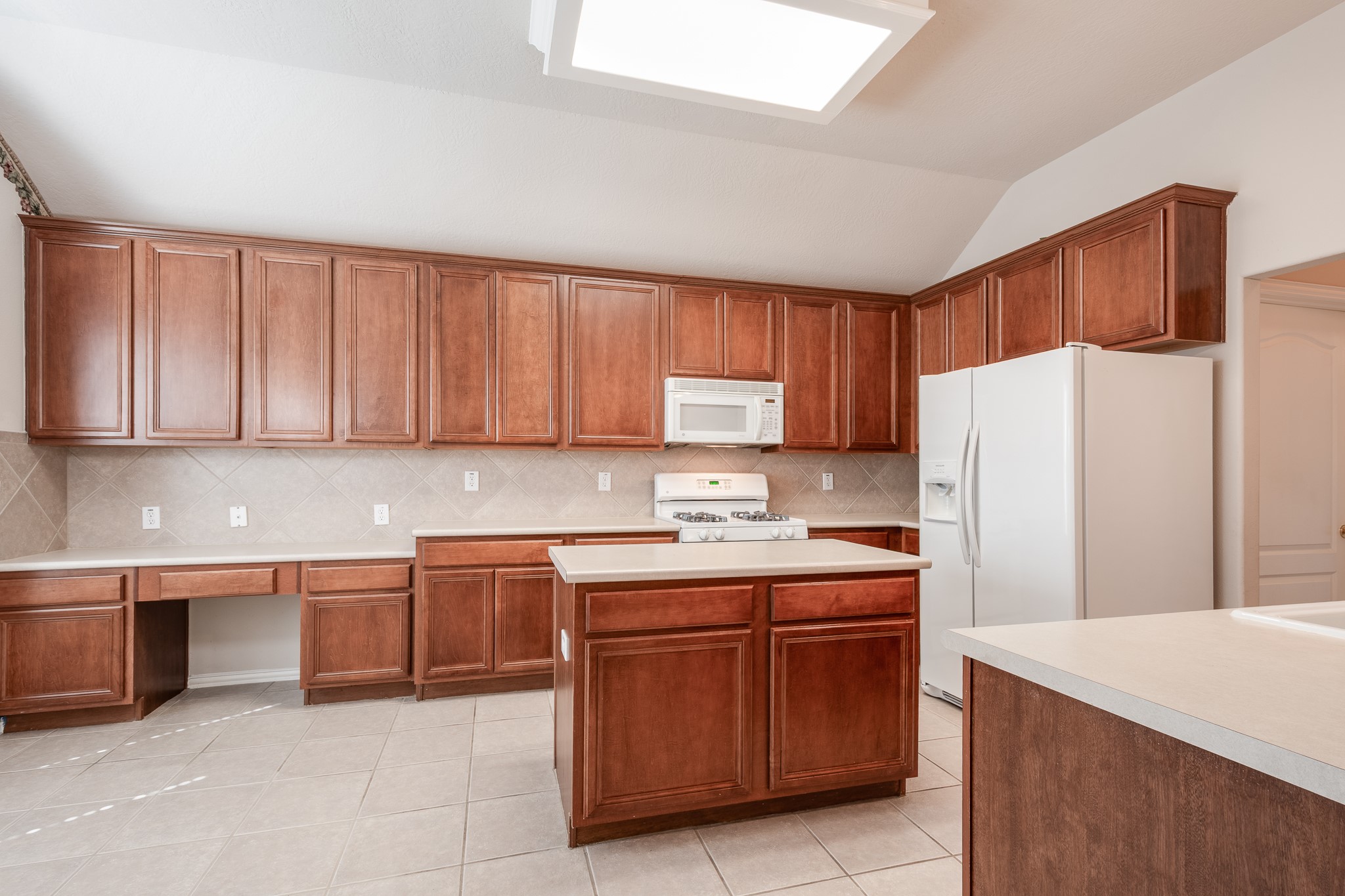 5914 Birdie Way Pasadena, TX 77505 - Photo 12 of 32 a kitchen with stainless steel appliances a refrigerator and a stove top oven