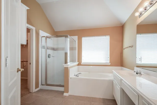 a bathroom with a bathtub and a sink